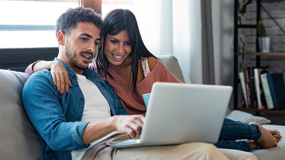 A couple using a computer